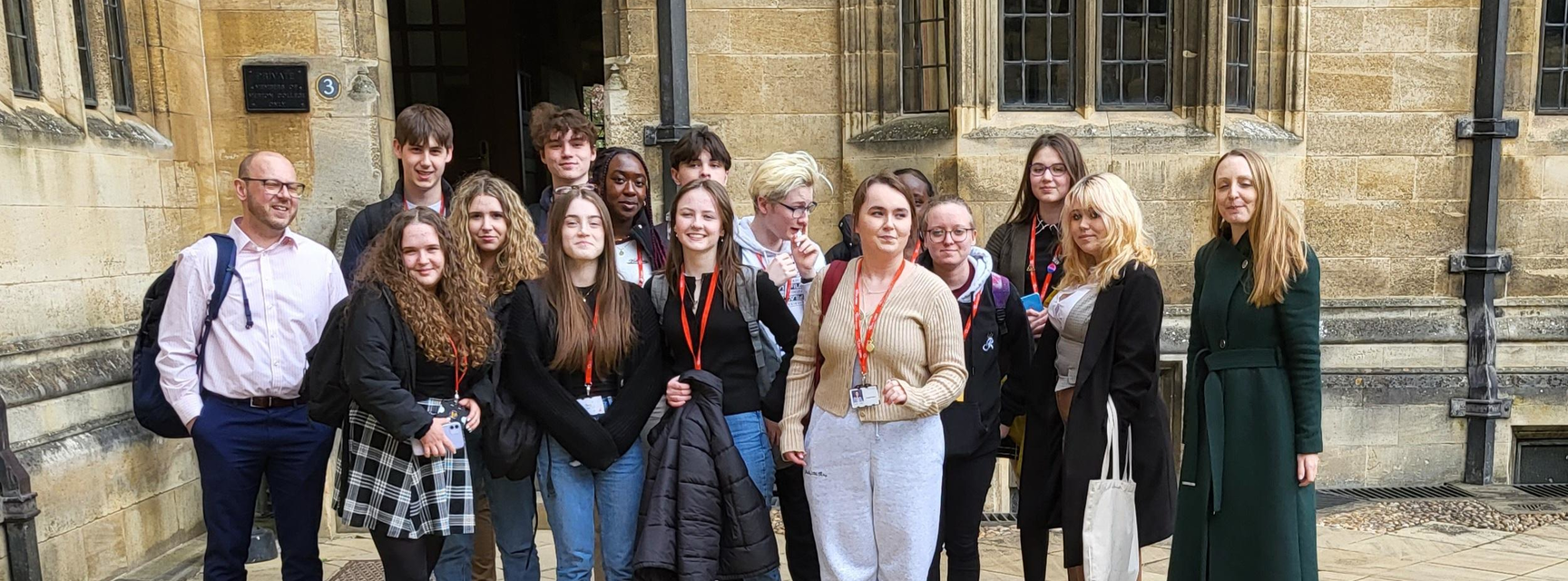 The student participants stand outside of Merton College