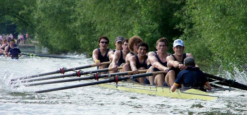 A team of eight men row along one of Oxford's rivers