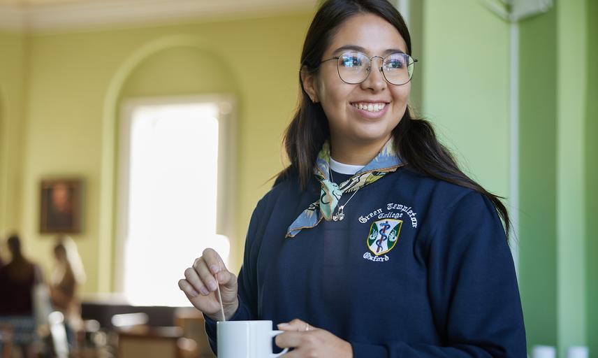 A student makes a cup of tea in college