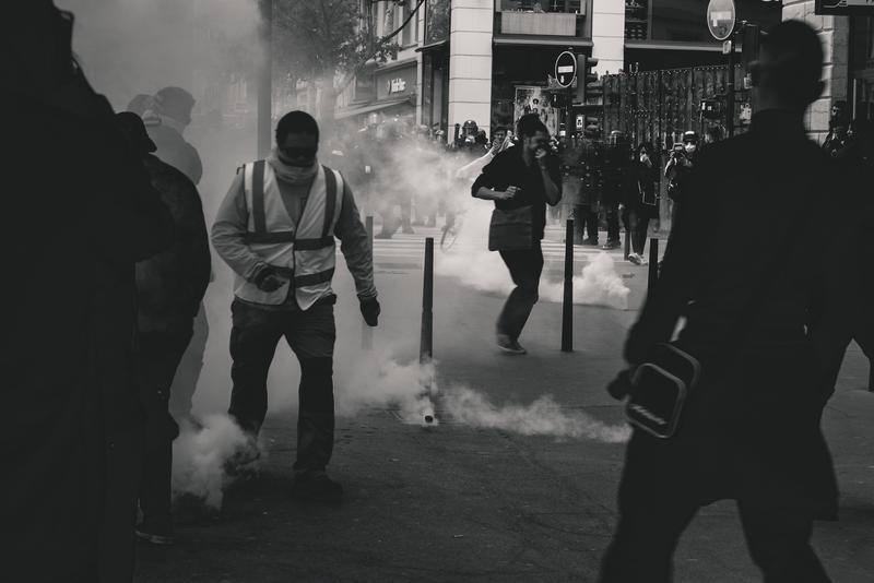Black & white image of protesters and police
