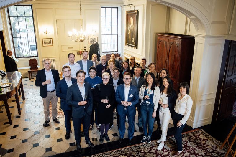 Workshop attendees stand as a group in St John's College