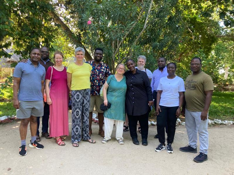 Members of the STREAMS project stand outside under the trees