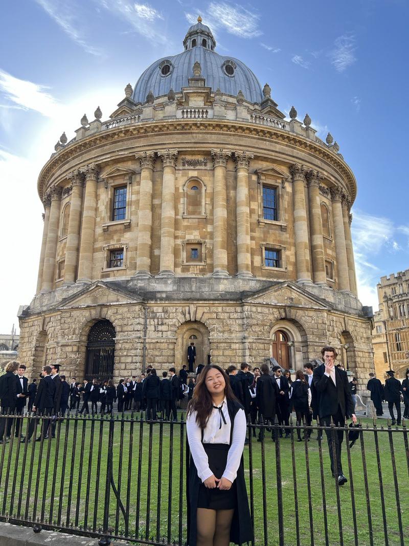 Rachyl Lim stands in front of the Radcliffe Camera during her Matriculation 