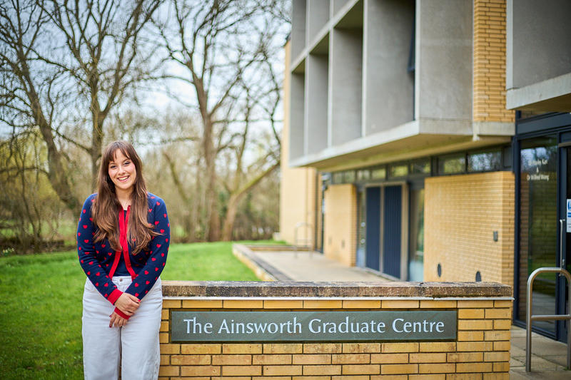 Image of Emma Somos outside of the Ainsworth Graduate Centre