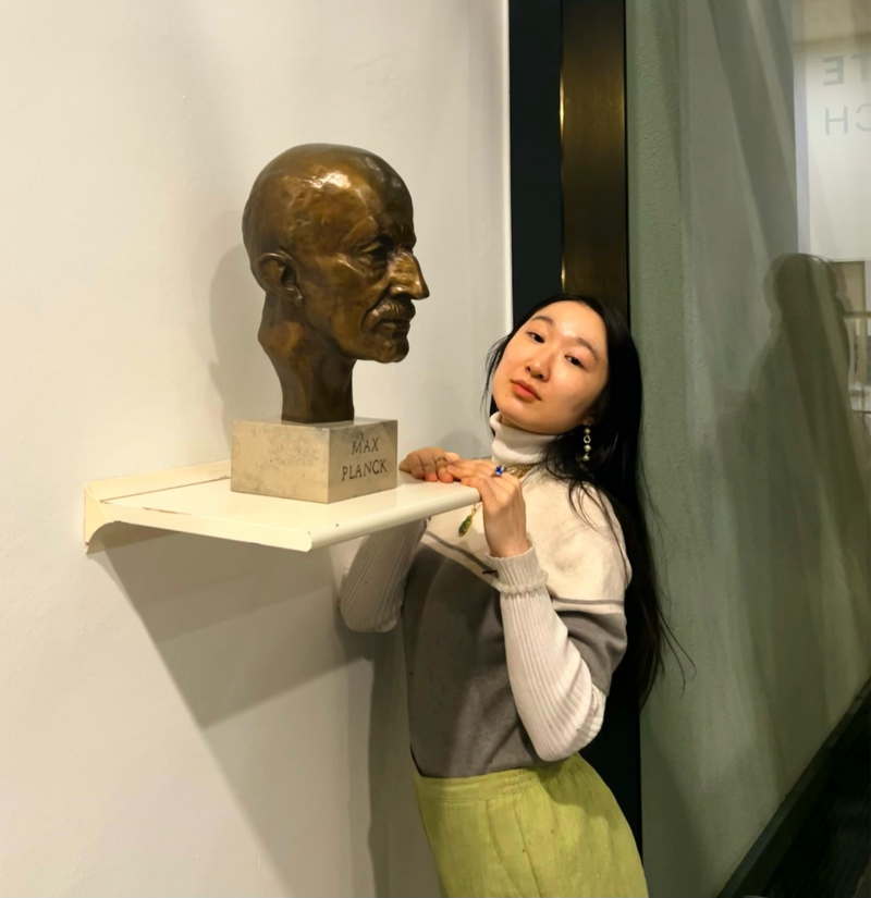 Linda Cheng photographed next to a bust of Max Planck