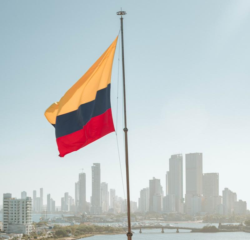 A Colombian flag flies in front of the Cartagena skyline