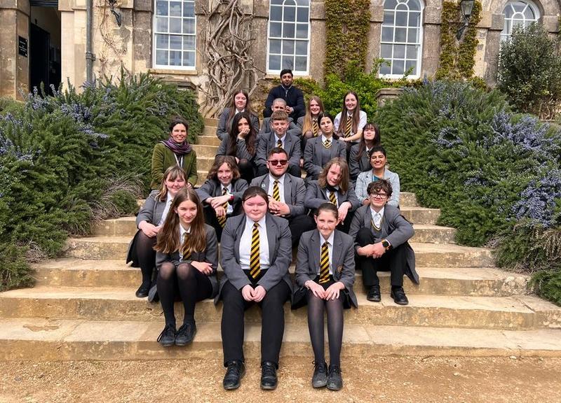 Students and teachers sit on the steps at Worcester College