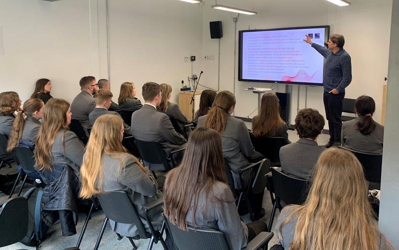 School students listen to a lecture for Professor Christiaan Monden