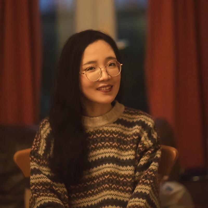 Image of Xinyi Zhao sitting down