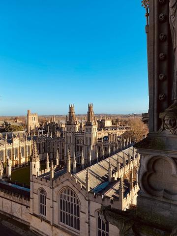 University of Oxford buildings against a clear blue sky