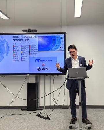Image of Xiaoguang Fan presenting at the workshop