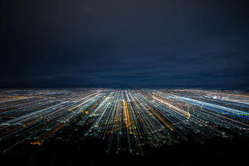 A city at night with blurred light trails