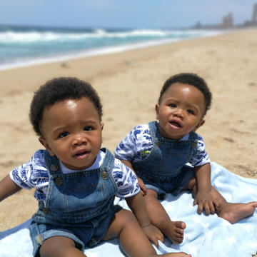 Twin babies at the beach