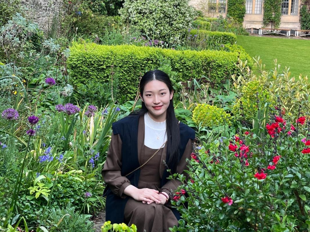 Yanjing Lu in the gardens of The Queen's College