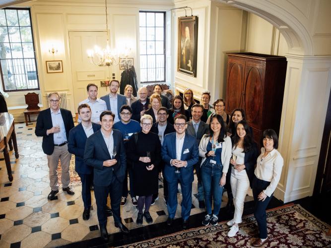 Workshop attendees stand as a group in St John's College