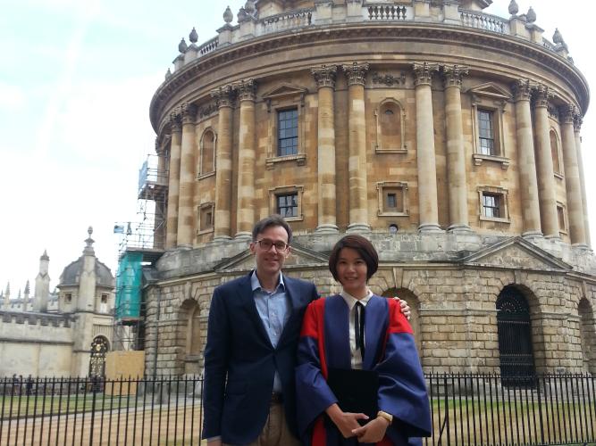 Image of Rebecca Wong with Professor Federico Varese outside of the Radcliffe Camera