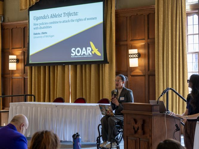 Dakota J Betts presenting at a conference