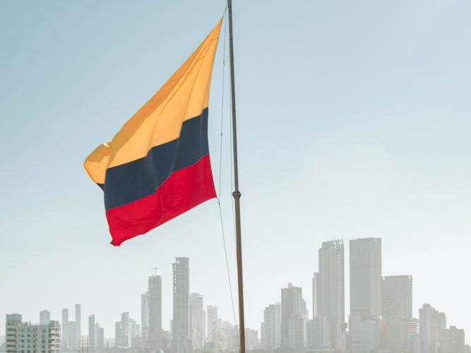 A Colombian flag flies in front of the Cartagena skyline