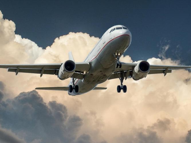 Image of plane flying through clouds