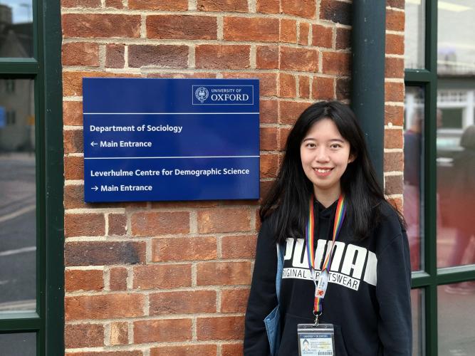 image of Qiuyue Lin outside of the Department of Sociology 