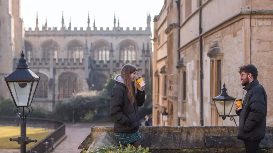 Two students meeting outside in Oxford. Photo credit: John Cairns