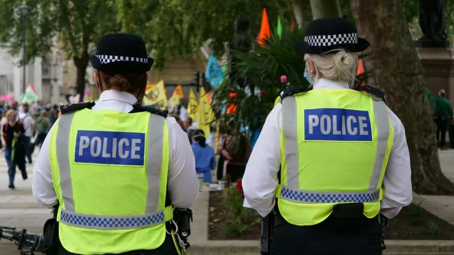 Image of two police officers facing away from the camera