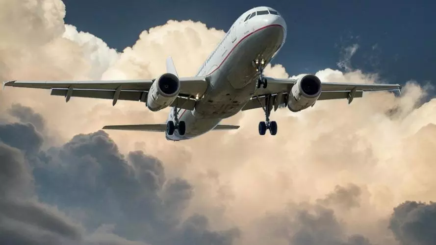 Image of plane flying through clouds