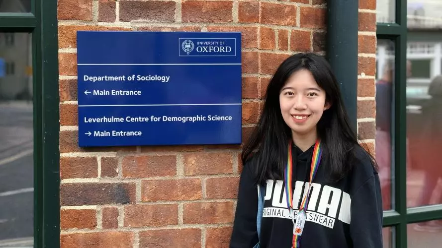 image of Qiuyue Lin outside of the Department of Sociology 