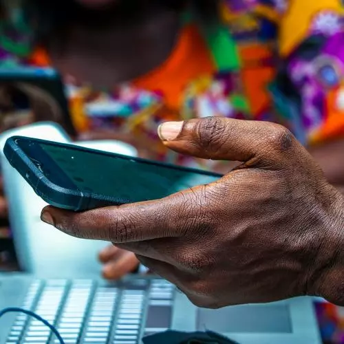 Image of someone holding a mobile phone
