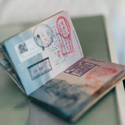 An open passport showing stamps from various countries
