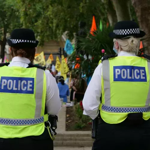 Image of two police officers facing away from the camera