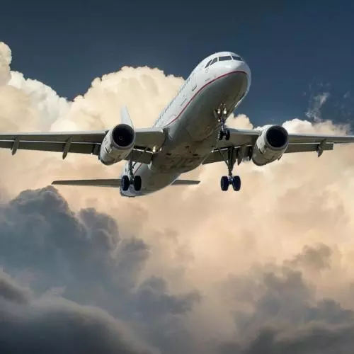 Image of plane flying through clouds