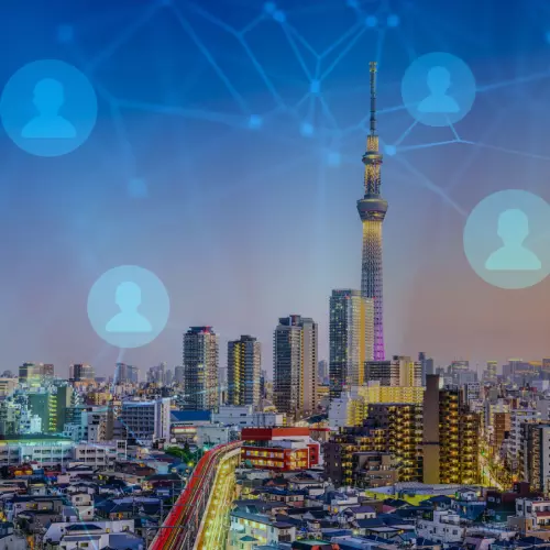 Image of Japanese city skyline overlaid with network graphic 