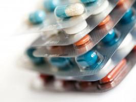 Different coloured pills in packets