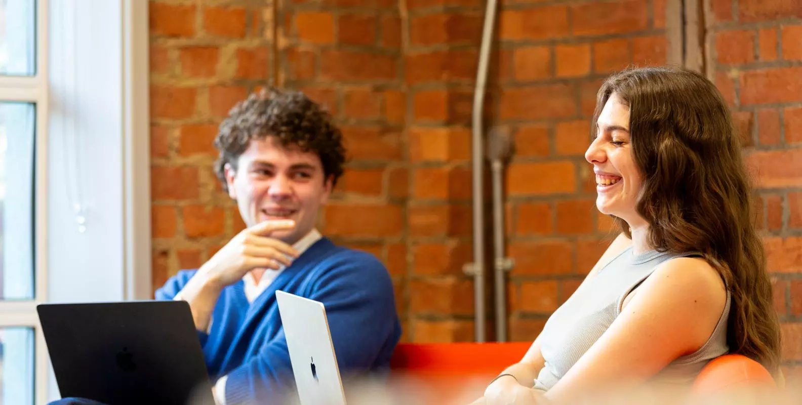 Image of two students laughing in the Department 