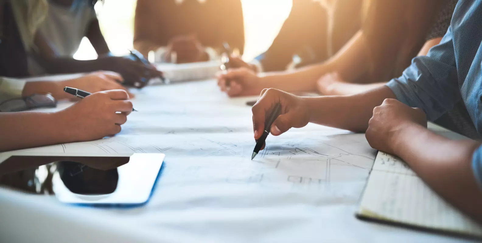 Several people work collaboratively at a table