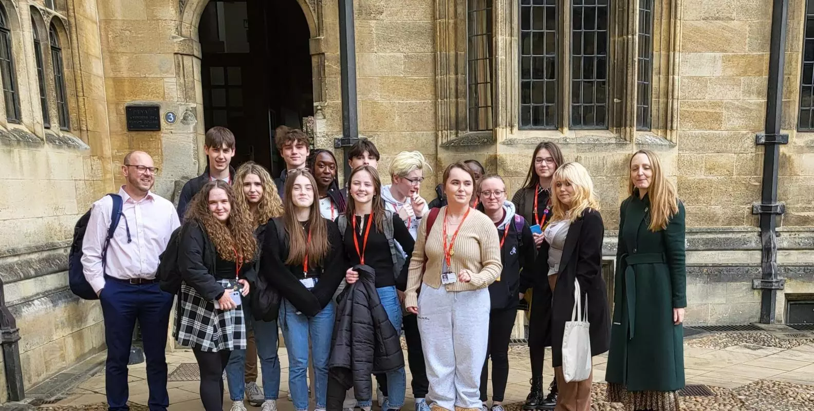 The student participants stand outside of Merton College